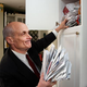 Chertoff looks in vain through the cabinet where the Department of Homeland Security keeps all its bills.